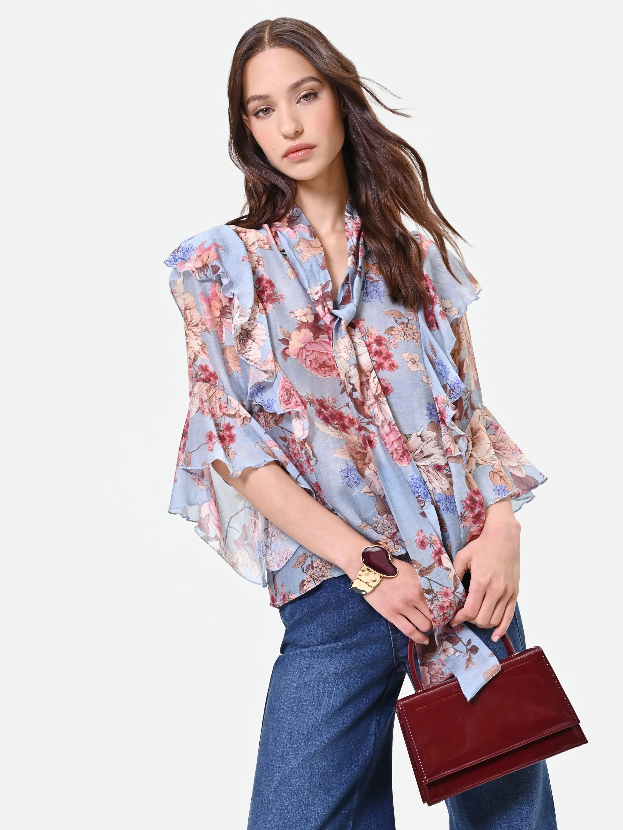 Blusa azzurra con fantasia floreale e fiocco - Image 6