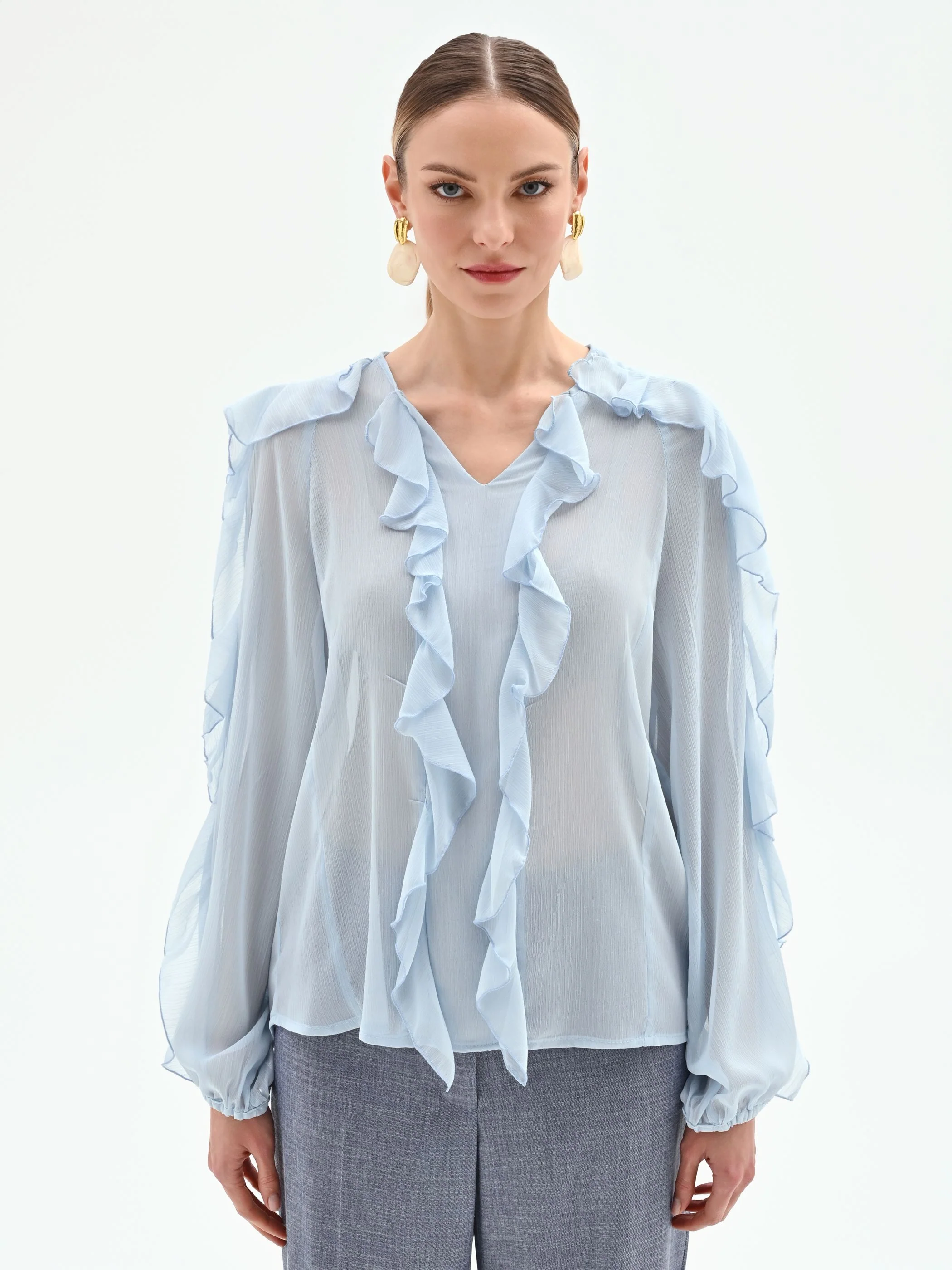 Blusa azzurro cielo con rouches