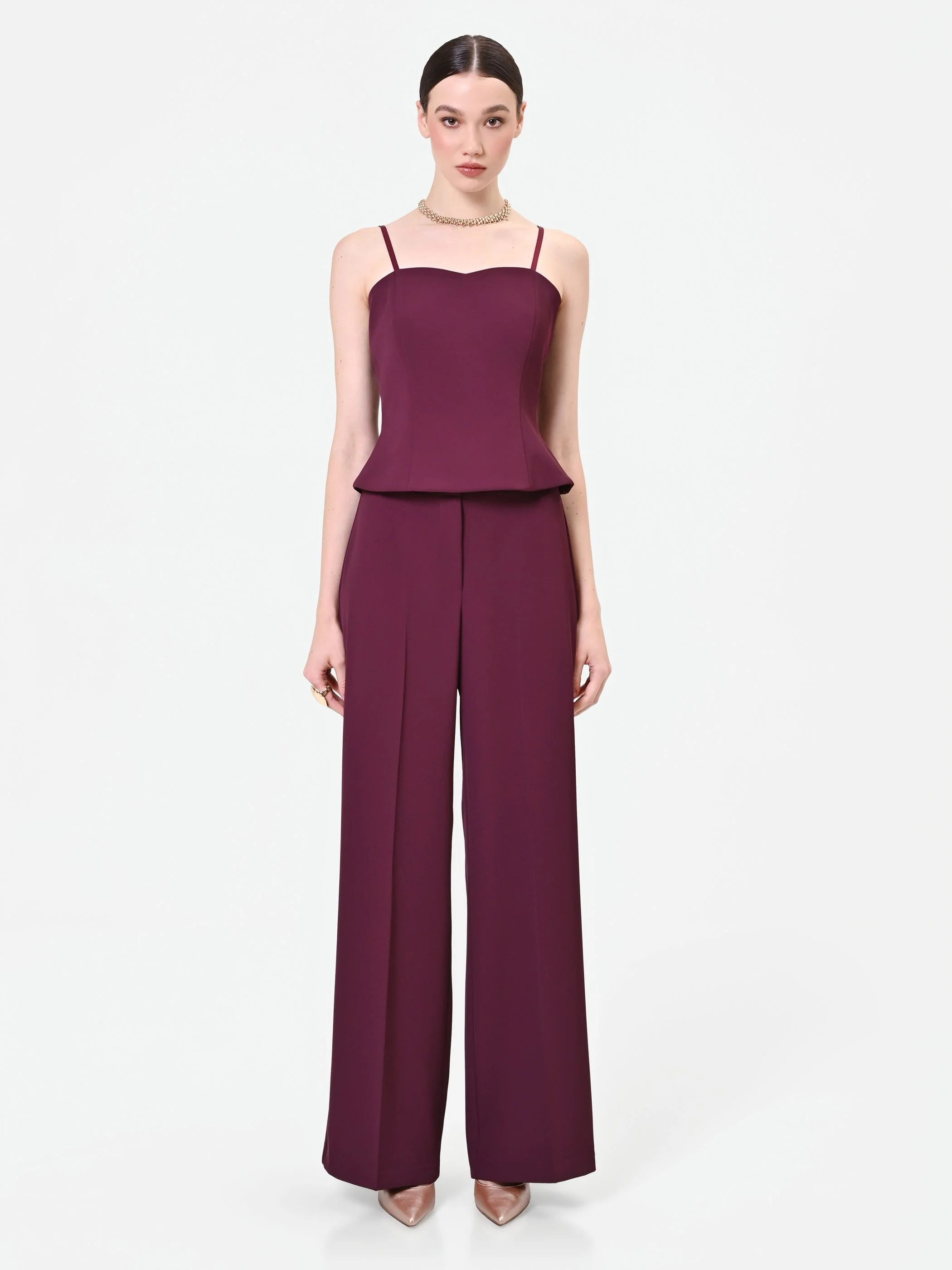 Pantalone a palazzo bordeaux dalla linea fluida