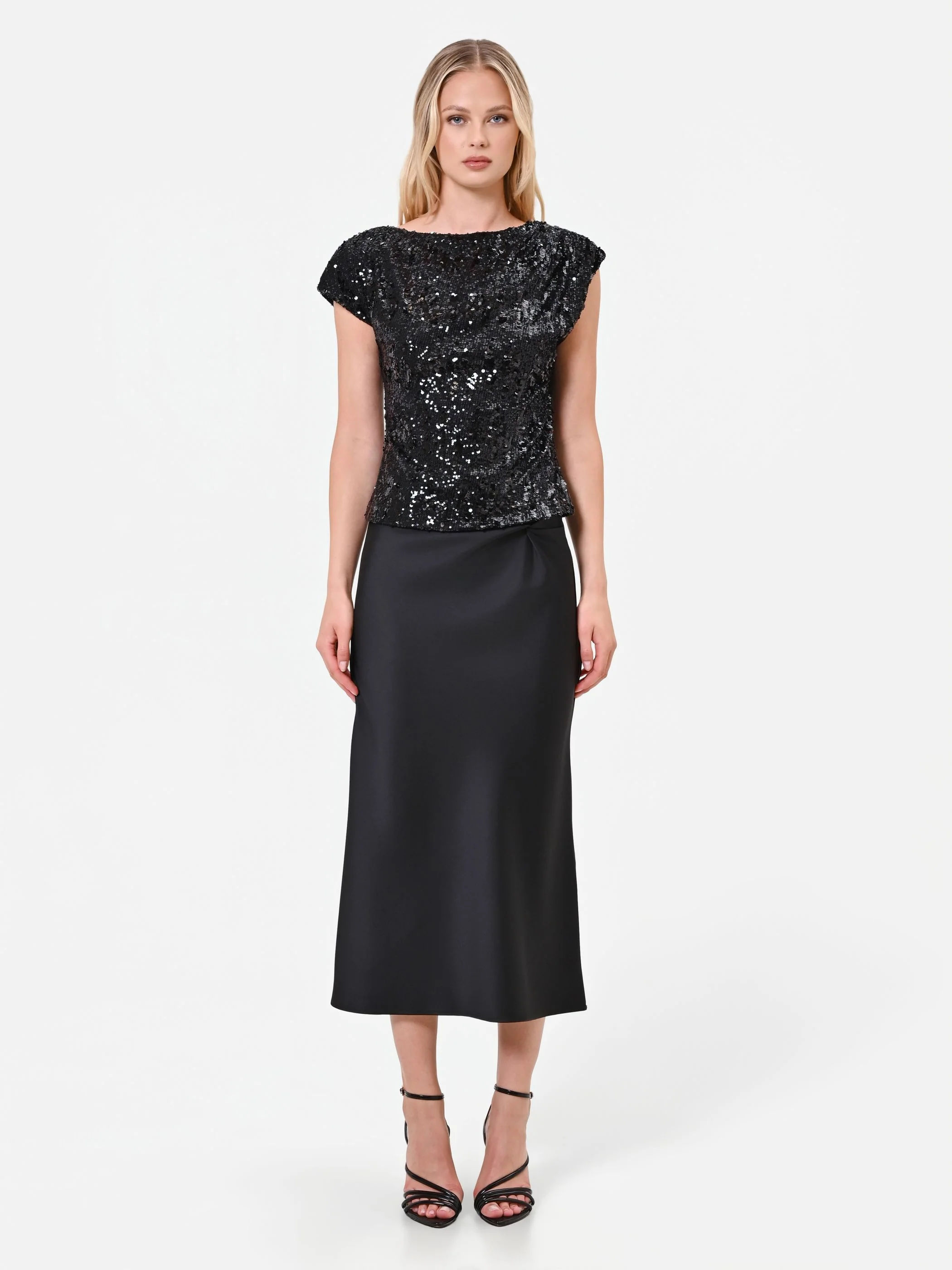 Top nero in paillettes con fondo sfalsato